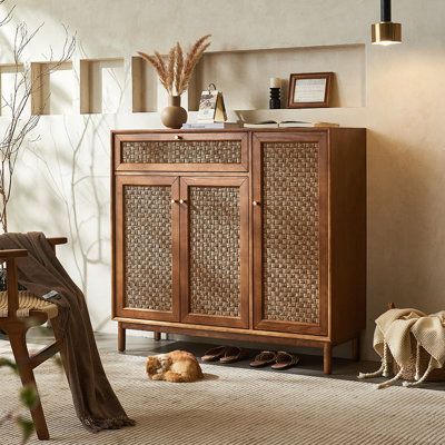 a wooden cabinet sitting in the middle of a living room