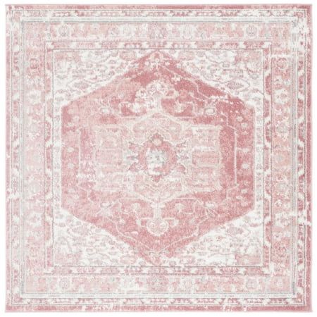 a pink and white rug with an ornate design on the center, in front of a white background