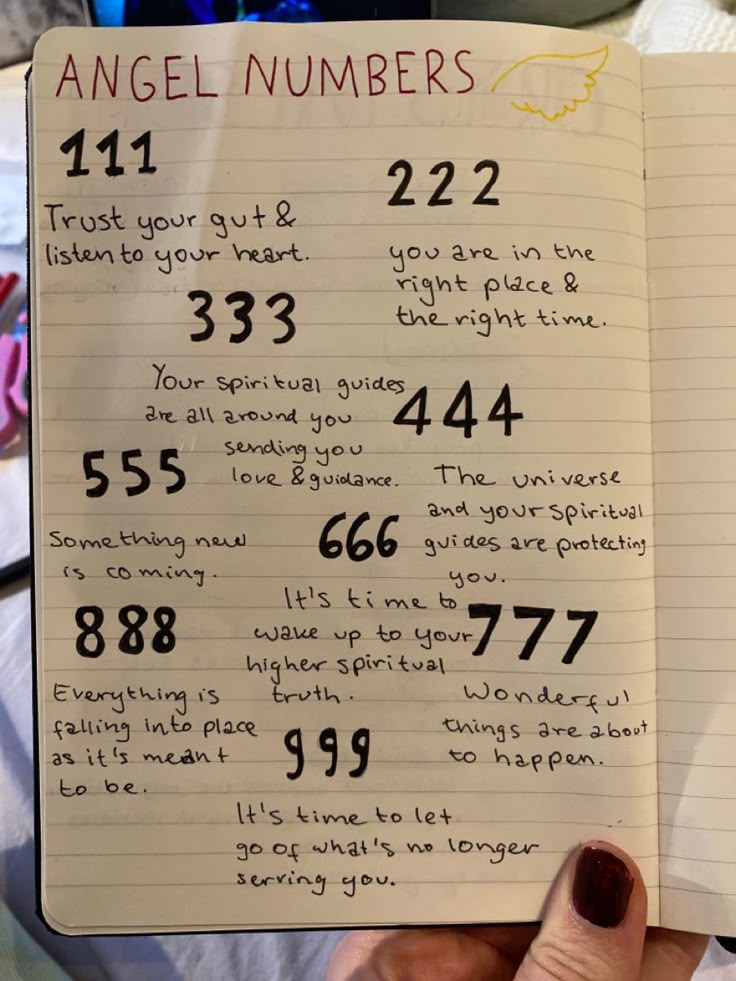 an open notebook with numbers written on it