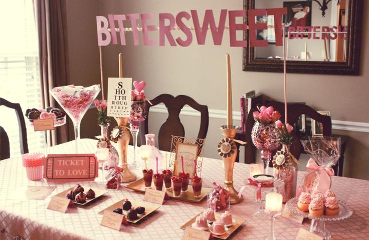 a table topped with lots of desserts and candles