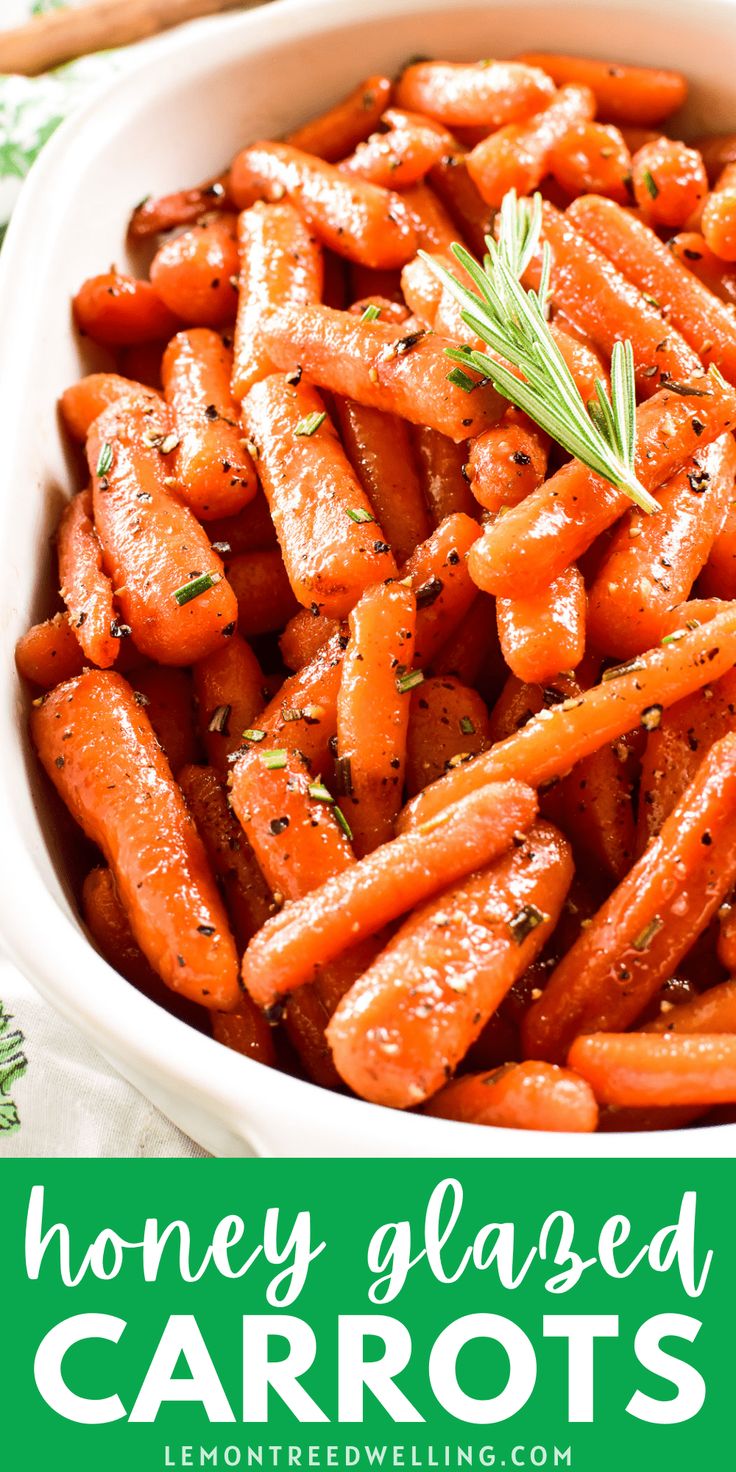 honey glazed carrots in a white bowl with rosemary garnish on the side