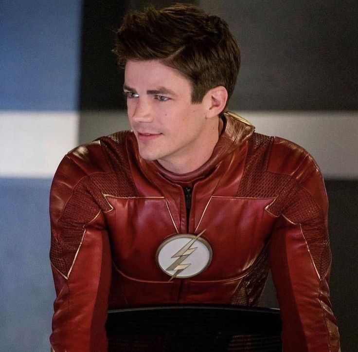 the flash is sitting down and looking at something