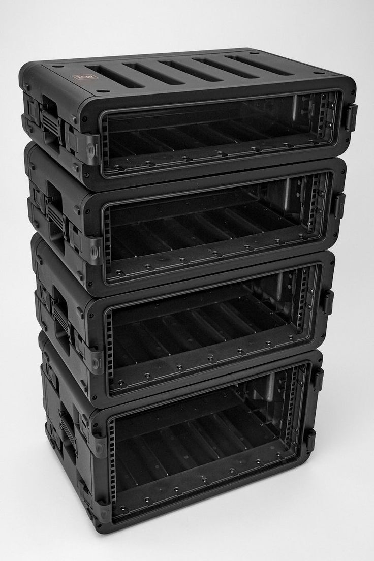 four black plastic storage containers stacked on top of each other in the shape of a stack