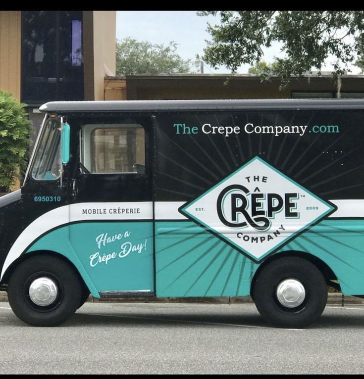 the crepe company truck is parked on the side of the street