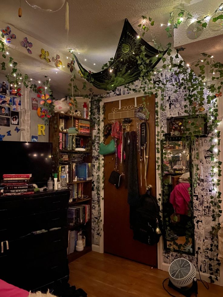 the room is decorated with ivy and fairy lights