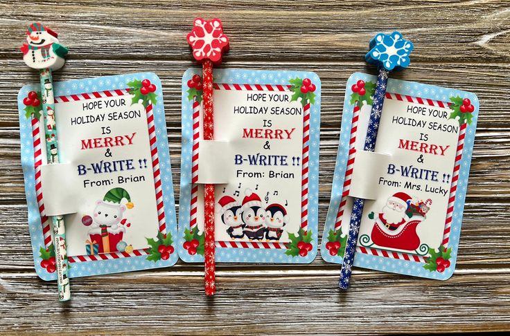 three christmas tags with candy canes attached to them