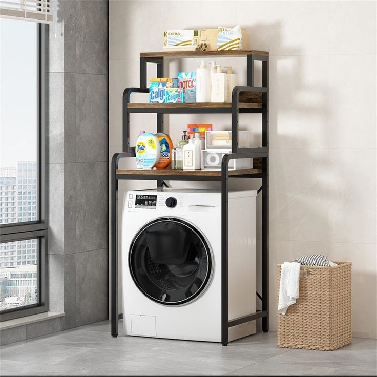 a washer sitting in front of a window next to a shelf