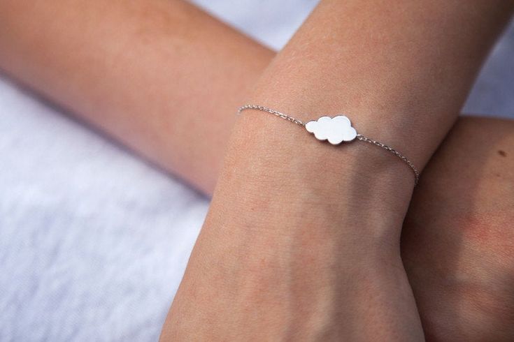 "This cloud bracelet is a perfect gift! 'Every cloud has a silver lining' For the times when you may be feeling low, this positive phrase is used to say that out of every problem some good can come of it. This lovely bracelet will arrive in a organza bag, ready for gifting or to keep for yourself This simple bracelet adds a special little something to your look! Perfect for everyday wear :) Size: Adjustable bracelet length from 6.5\" to 8\". Material: Sterling version: 100% sterling silver Gold Cloud Bracelet, Simple Bracelets, Bracelet Sterling Silver, Gold Filled Jewelry, Adjustable Bracelet, Gold Bangles, Chain Link Bracelet, Silver Bracelets, Delicate Bracelet