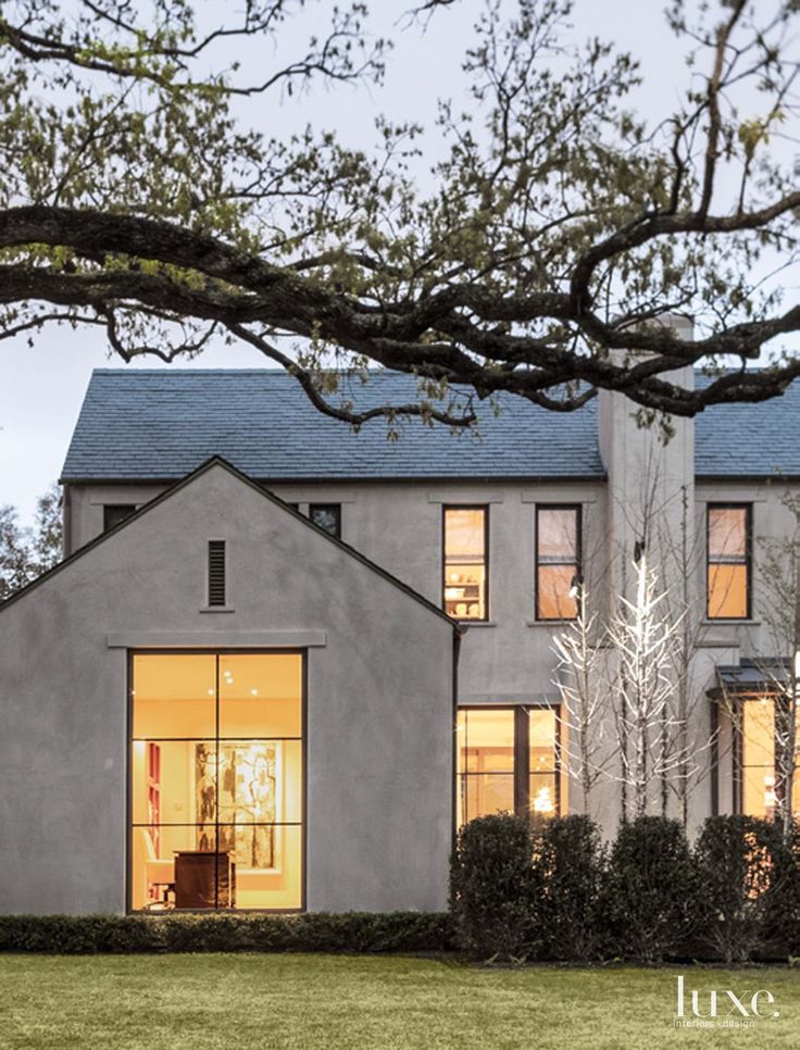 a large gray house with lots of windows