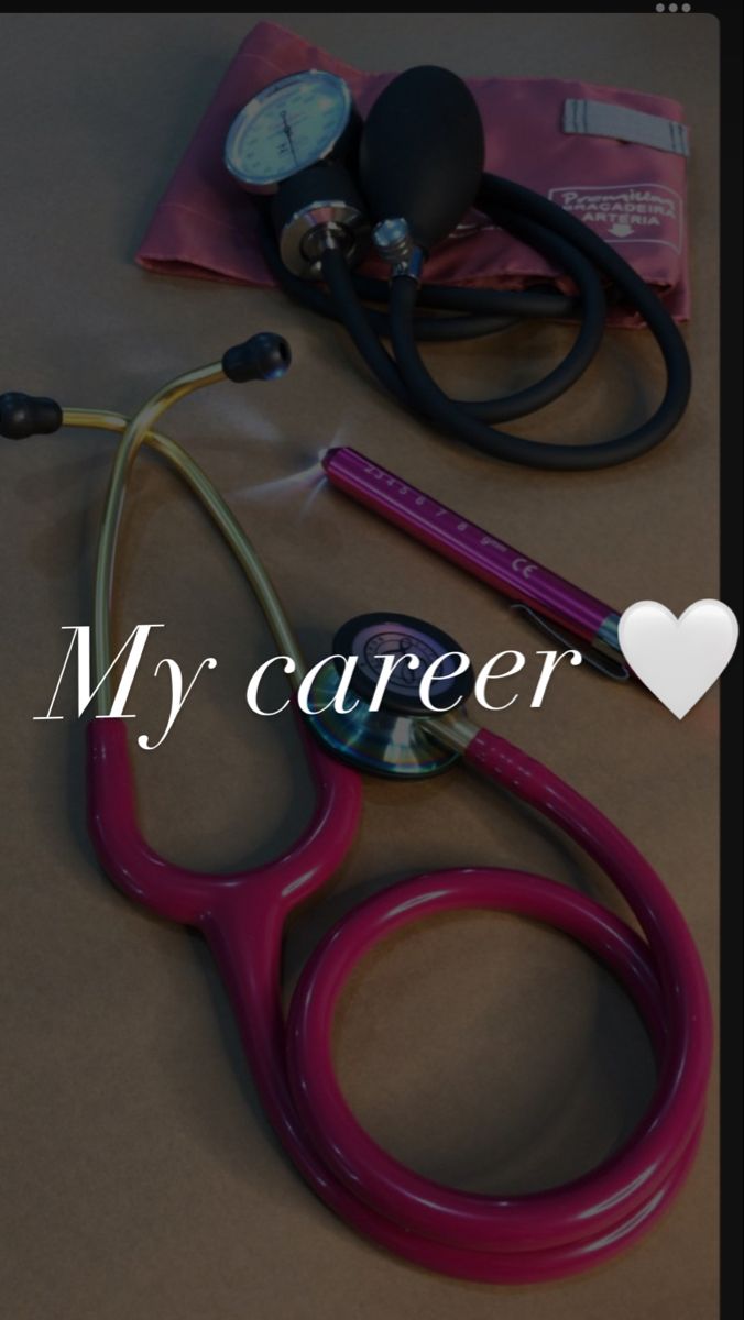 a pair of stethoscopes sitting on top of a table next to a heart