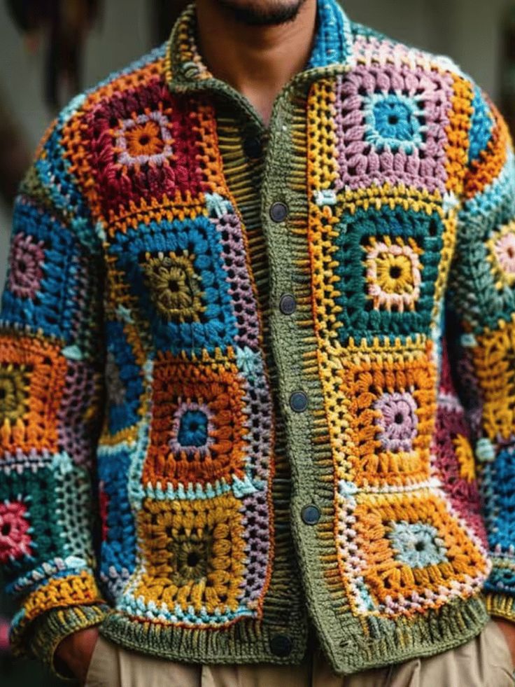 a man wearing a multicolored crocheted jacket