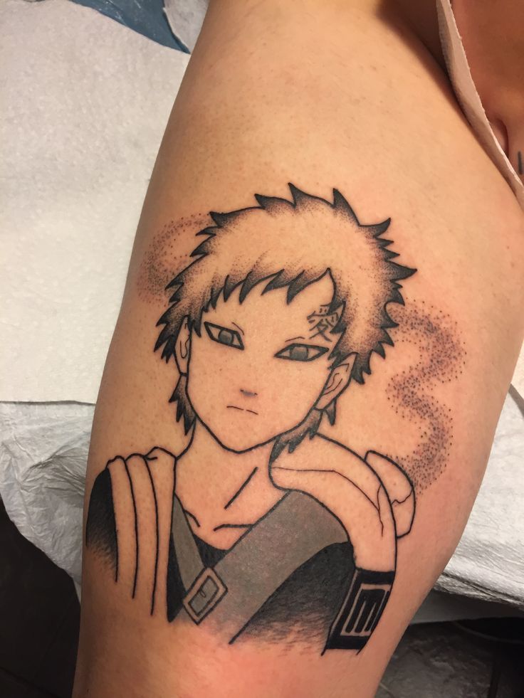 a person with a tattoo on their arm that has an image of naruta