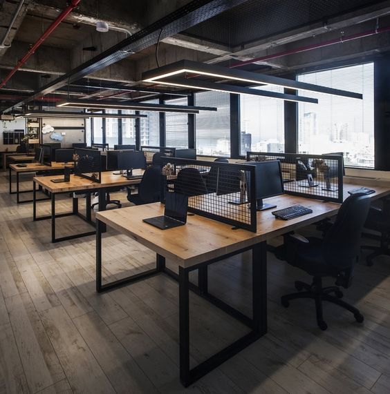 an empty office with desks and chairs