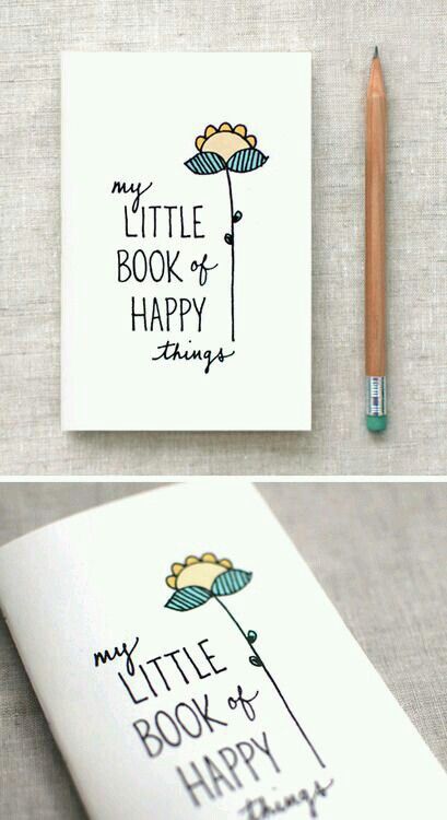 a book with some writing on it next to a pencil and an image of a flower