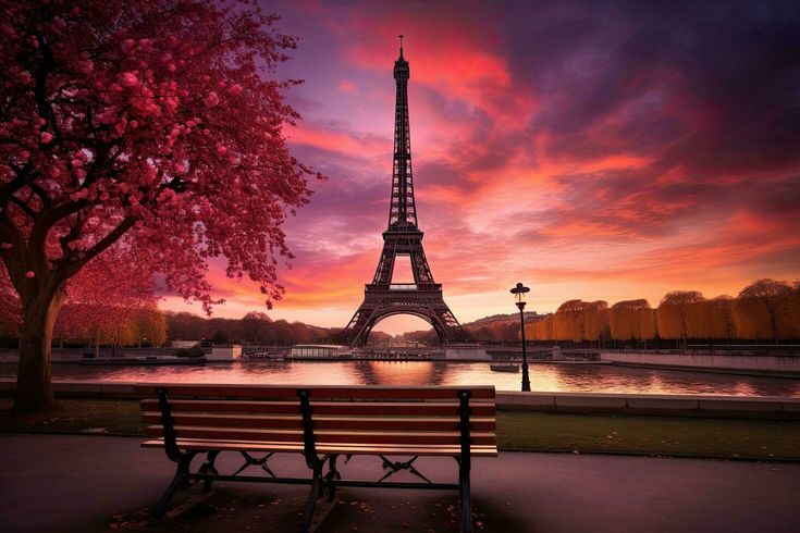 the eiffel tower is lit up in pink and purple colors as the sun sets