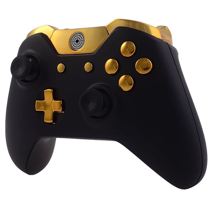 a close up of a black and gold controller