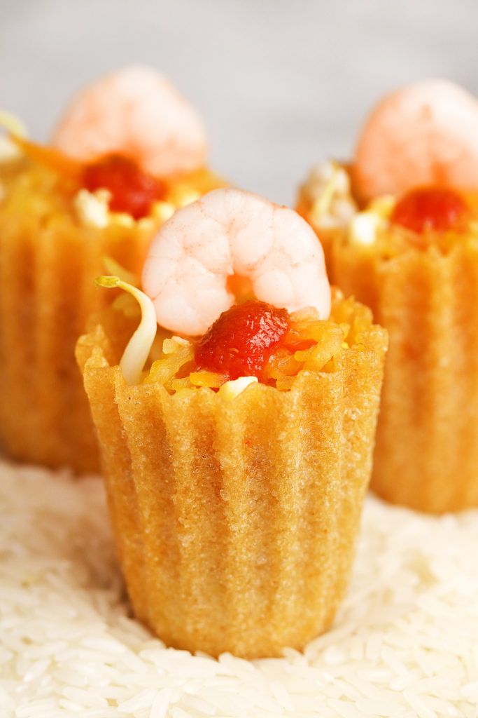 small food items are placed on top of rice