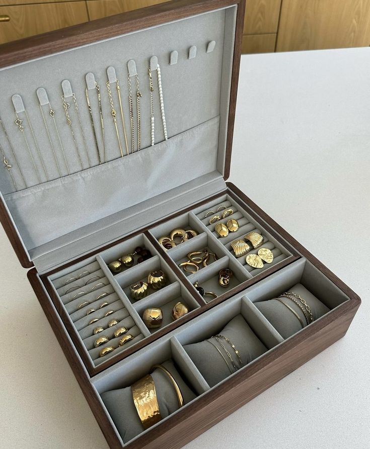 an open jewelry box on a white table