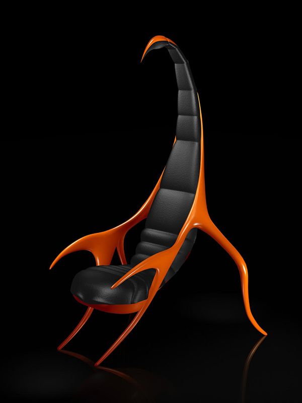 an orange and black chair sitting in the dark