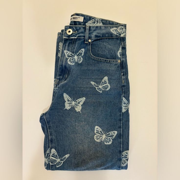 Brand: Blue Savvy Size: 9/29 Condition: Never Worn Material: Jean With Butterfly Prints Color: Blue With White Butterflies Super Cute Trendy Spring Butterfly Print Bottoms, Trendy Butterfly Print Bottoms For Spring, Jeans With Butterflies, Butterfly Halloween Costume, Ears Tour, Butterfly Jeans, Style 2025, Butterfly Halloween, Butterfly Clothes