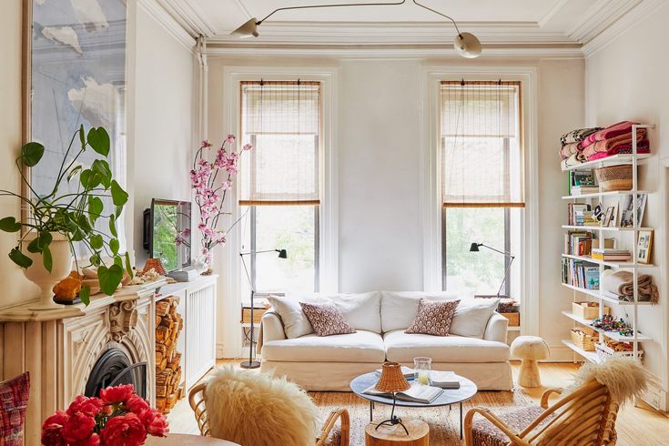 a living room filled with furniture and lots of windows