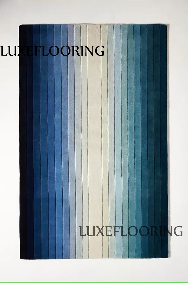 a blue and white rug with the words lubeflooring on it