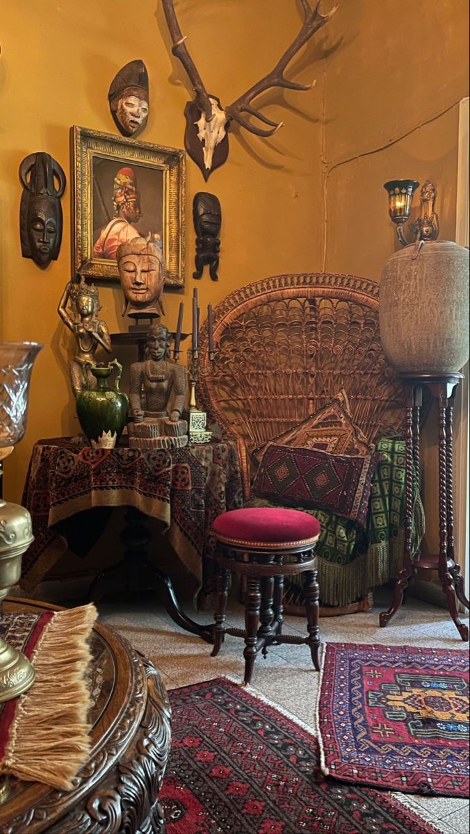 a living room filled with lots of furniture and antelope heads on the wall