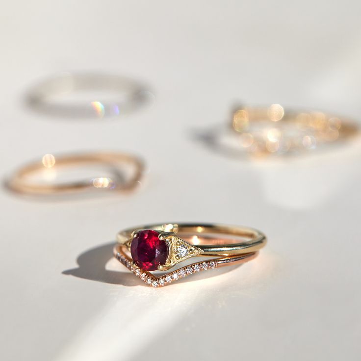 A romantic ruby, set between Jennie Kwon�s signature milgrain-edged triangles. Classic, with modern touches: a 21st century ring. See "Details" for item specifics (carat weight, metal, etc) Luxury Trillion Cut Ring With Accent Stones, Luxury Ruby Marquise Cut Rings, Luxury Stackable Ruby Ring For Anniversary, Luxury Stackable Ruby Ring For Wedding, Timeless Ruby Ring With Rose Cut Diamonds For Wedding, Timeless Round Cut Ruby Diamond Ring, Luxury Ruby Birthstone Ring For Wedding, Red Promise Ring With Diamond Accents, Classic Ruby Ring With Diamond Cut