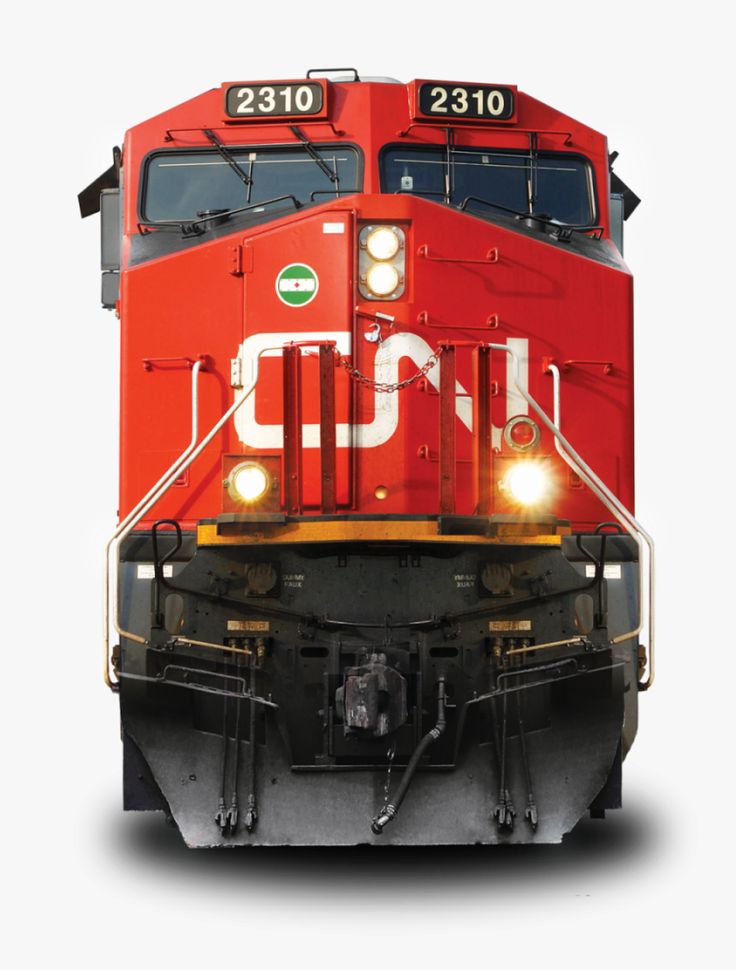 a red train engine with its lights on