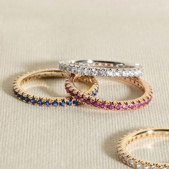 This modern take on an eternity ring features a full circle band of delicate yet sparkly natural emerald gemstones from the Juliette Maison™ collection. Fashioned in 10K rose gold, Wear to add a subtle sparkle to any finger, or style as an accent to your go-to stack of rings. Fine Jewelry Rose Gold Eternity Band With Prong Setting, Rose Gold Half Eternity Stackable Rings, Rose Gold Half Eternity Band Fine Jewelry, Rose Gold Round Cut Eternity Band With Halo, Rose Gold Halo Round Cut Eternity Band, Rose Gold Round Eternity Band Fine Jewelry, Luxury Rose Gold Round Eternity Band, Rose Gold Round Band Eternity Ring, Rose Gold Halo Eternity Band