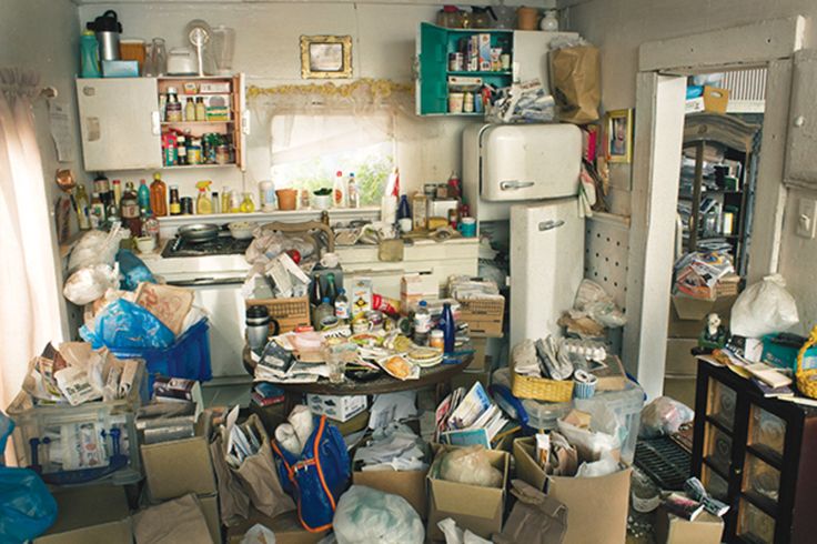 a cluttered kitchen filled with lots of clutter