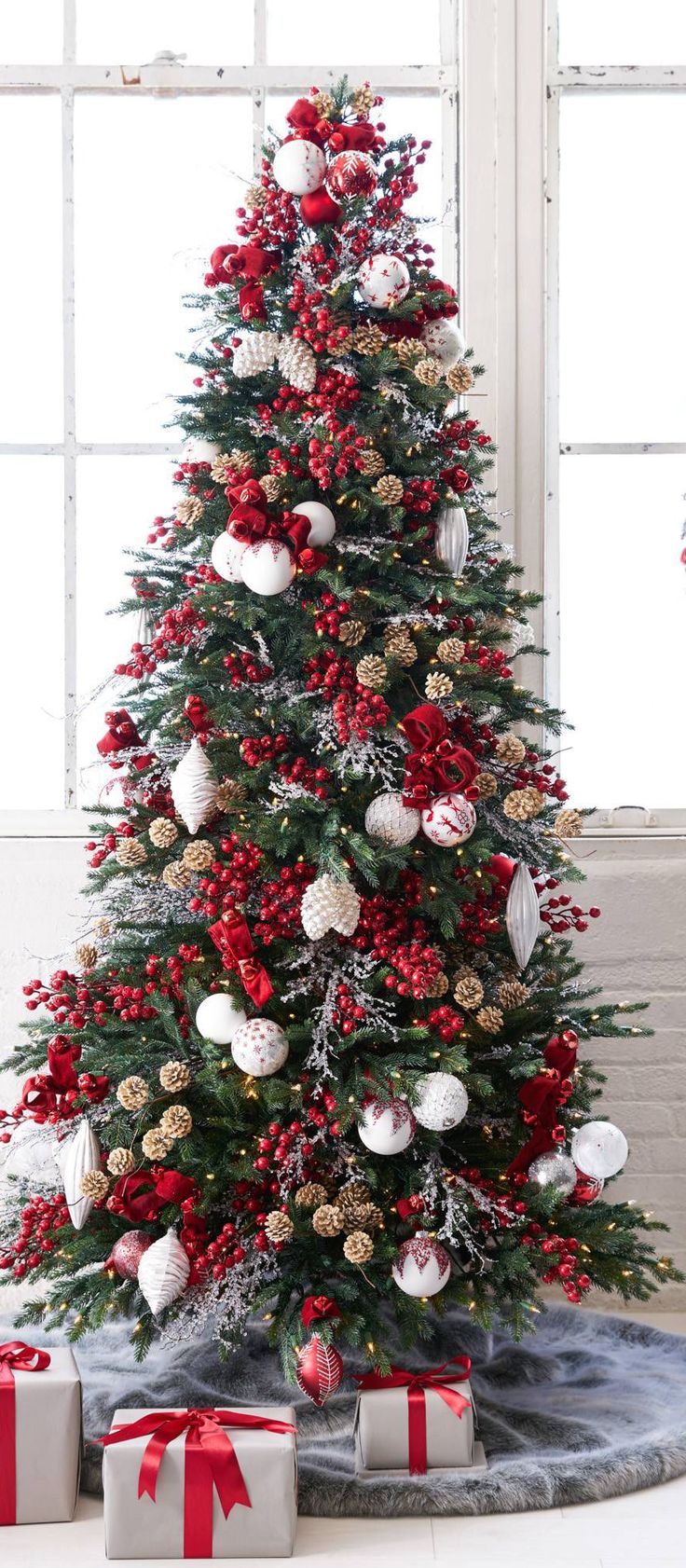 a decorated christmas tree with presents under it