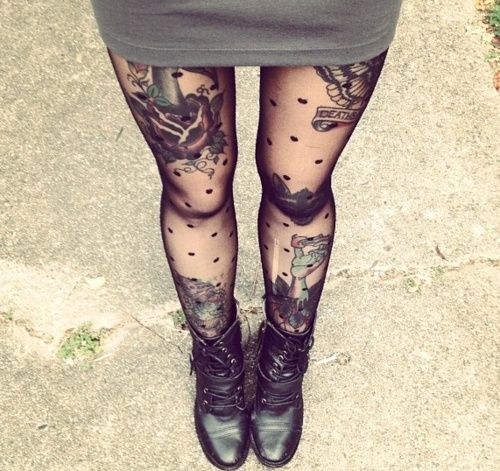 black and white photograph of woman with tattoos on her legs