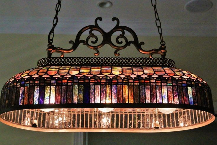 a stained glass chandelier hanging from the ceiling