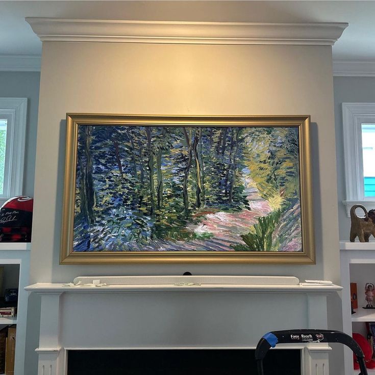 a painting hanging on the wall above a fireplace