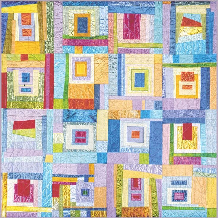 a colorful quilt with squares and rectangles on it