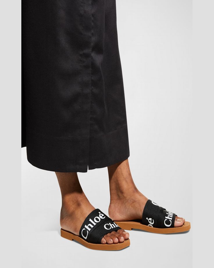 "Find CHLOÉ Woody Flat Logo Ribbon Slide Sandals on Editorialist. Chloe sandals with layered logo ribbon upper. 0.3\" flat heel. Open toe. Slideon style. Leather footbed. Rubber outsole. Imported." Chloe Sandals, Flat Logo, Ribbon Slides, Slide Sandals, Black Sandals, Open Toe, Chloe, Top Brands, Ribbon