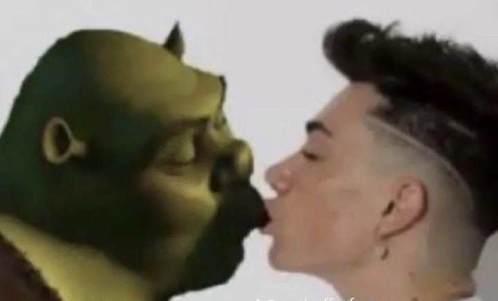 a man with a goatee is kissing another man's face in an animated style