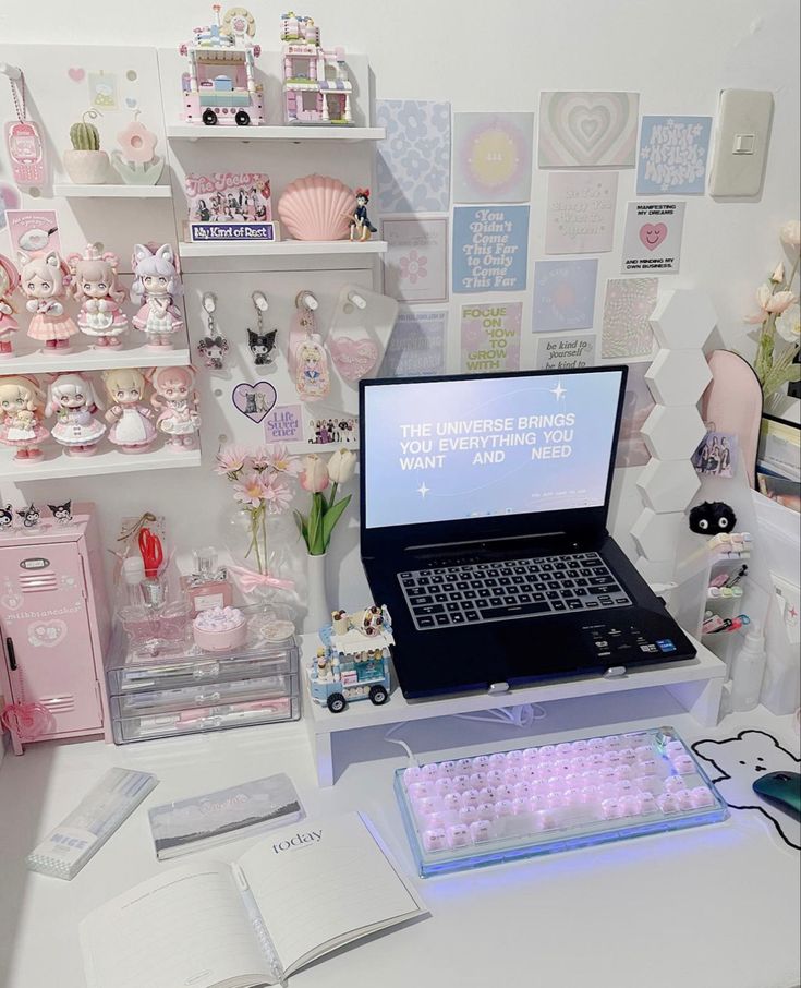 a laptop computer sitting on top of a white desk