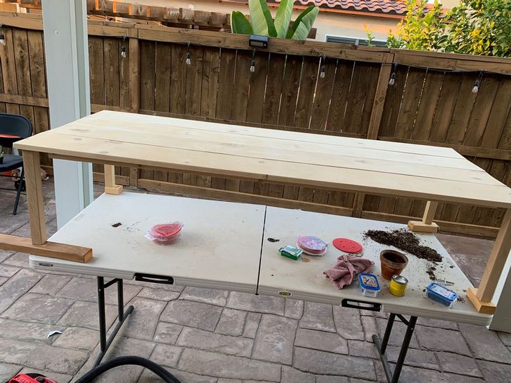 a table that has been built into the ground with some tools on top of it