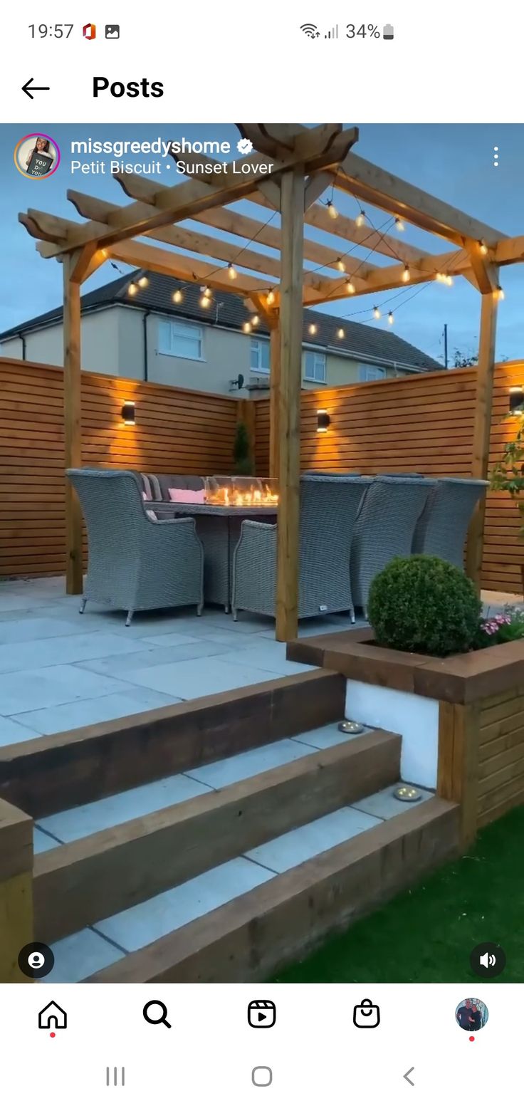 an outdoor living area with patio furniture and lights