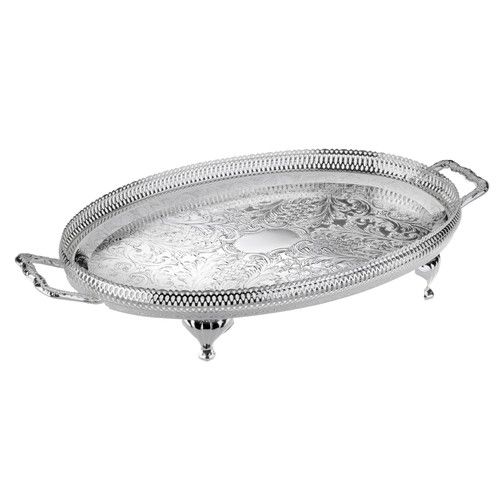 an ornate silver plate with handles