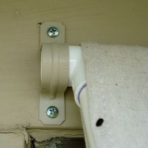 a close up of a white door handle on a wall