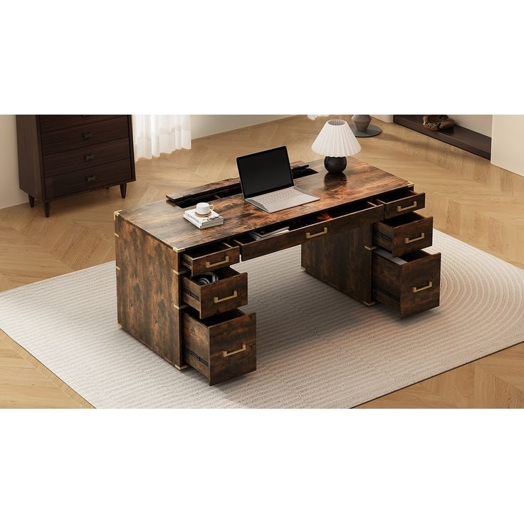 a wooden desk with drawers and a laptop on top of it in a living room