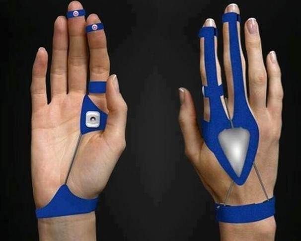 two hands with blue wristbands and one has an electronic device attached to it