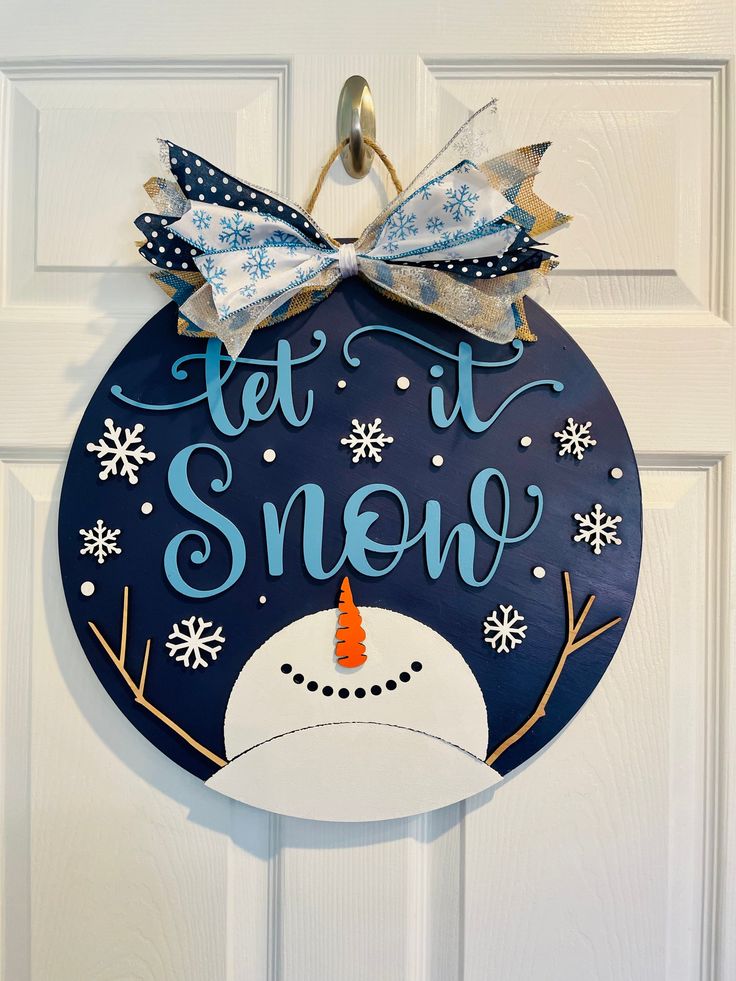 Let it Snow Door Hanger Round Wooden Door Hangers Snowman, Snowman Door Knob Hanger Sayings, Let It Snow Somewhere Else Wreath Sign, Winter Door Signs With Trees, Classroom Holiday Door Hangers, Please Don't Snow Door Hangers, Winter Door Signs Wooden, Winter Wreaths Wooden Circle, Winter Wooden Wreath