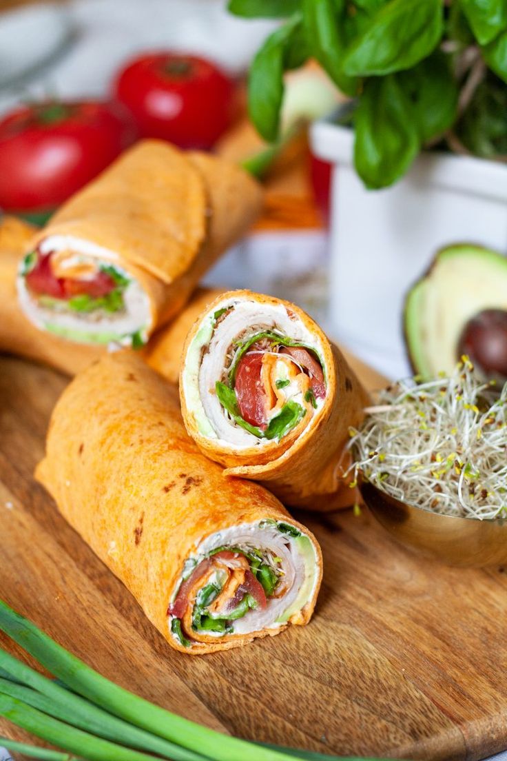 an assortment of food items on a wooden platter