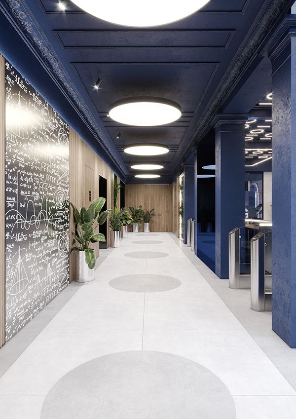 an empty hallway with chalk writing on the walls and potted plants at the end