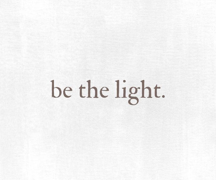 the words be the light written in brown on white paper