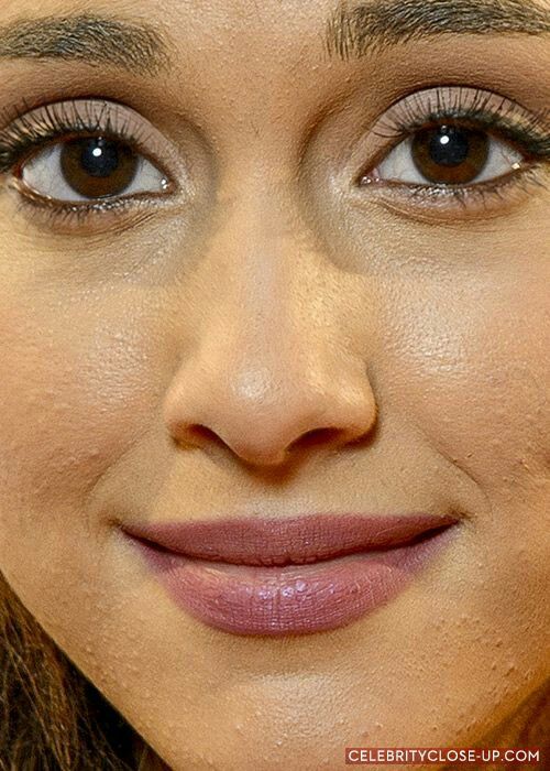 a close up photo of a woman's face